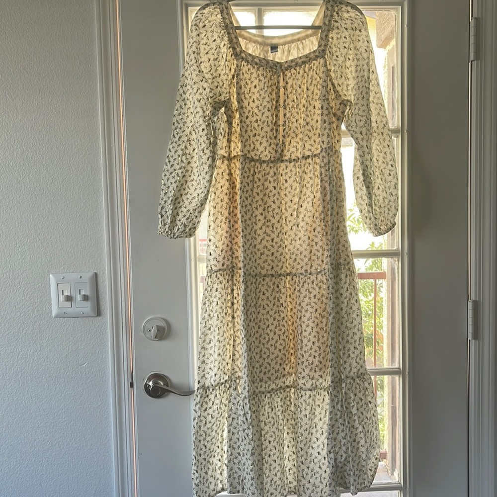 Beautiful prairie-like dress. Black floral print with gold embellishments